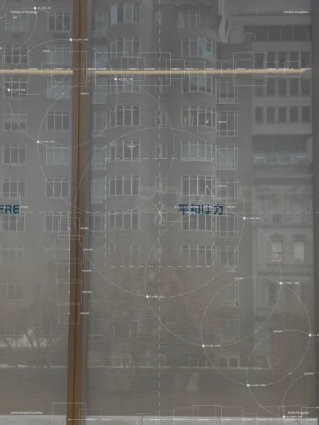A window onto a facade, overlaid with a drafting plate of circles and coordinates.